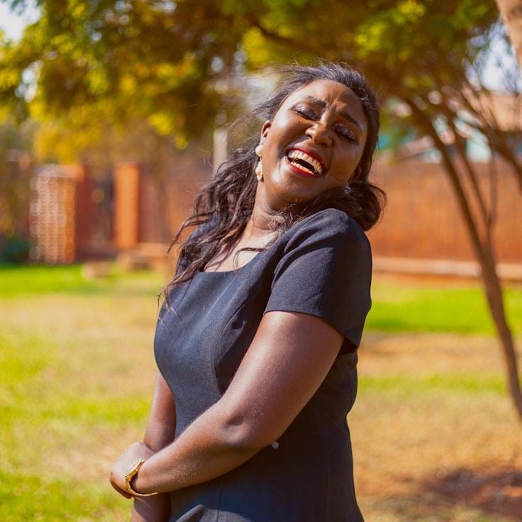Jordan Reed, Lead Design Curator at SunsetPrairieEcho, reviewing corporate floral arrangements
